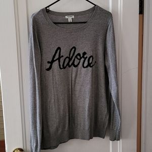 "Adore" sweater.